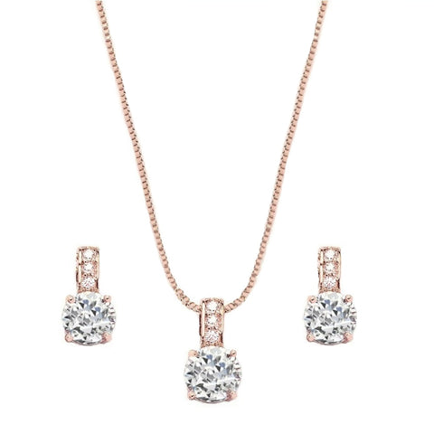 Adjustable necklace with clear crystals on a rose gold finish, with matching earrings, earrings measure 1cm. 