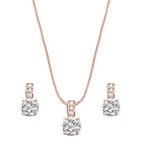 Adjustable necklace with clear crystals on a rose gold finish, with matching earrings, earrings measure 1cm.