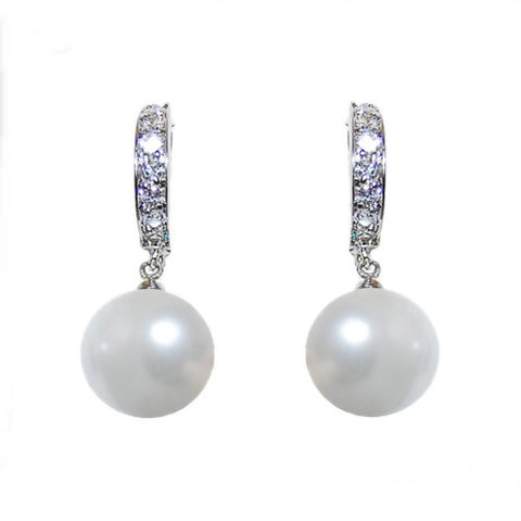 Crystal and pearl earrings made from high quality cubic zirconia clear crystals finished with ivory pearls. 