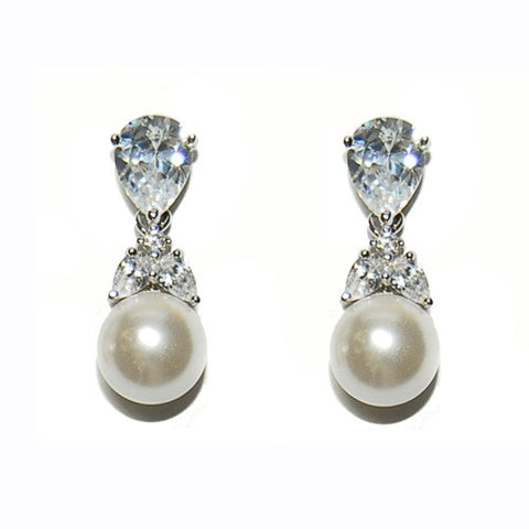 Crystal and pearl earrings made with high quality cubic zirconia clear crystals and ivory pearls on a rhodium plated finish, earrings measure 2.3cm. 
