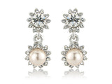 Crystal and pearl earrings made with cubic zirconia and Swarovski crystals married with ivory pearls, they have a drop of 2.5cm