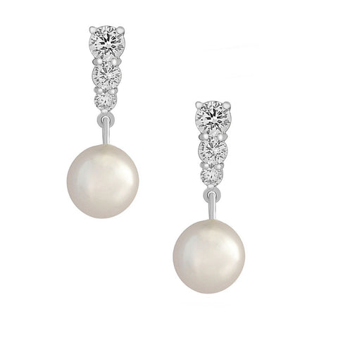 Crystal and pearl earrings made with high quality cubic zirconia crystals and ivory pearls on a rhodium finish, they have a drop 2.5cm.