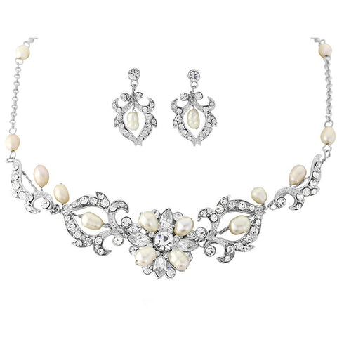 Crystal and pearl necklace and earrings set made with Swarovski crystals and freshwater ivory pearls plated in real silver, necklace is adjustable and the earrings measure 2.5cm