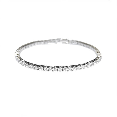 Petite and chic crystal bracelet made with clear cubic zirconia crystals on a silver tone rhodium plated finish.