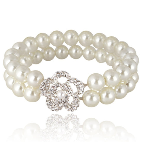 Elasticated pearl bracelet with a double row of pearls and a elegant clear crystal embellished flower. 
