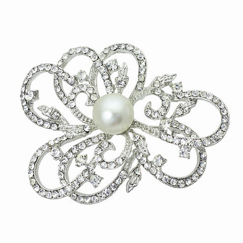 Crystal and pearl brooch made with clear crystals on a rhodium plated finish complimented by an ivory pearl