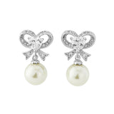 Clear crystal and Ivory pearl earrings in a unique bow style with a drop of 3cm