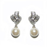 Crystal and pearl earrings made from high quality clear cubic zirconia crystals and ivory pearls on a rhodium plated finish, they have a drop of 2.5cm