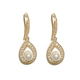 Crystal and pearl drop earrings made from high quality cubic zirconia clear crystals on a rhodium plated gold finish with pretty simulated ivory pearls, they have a drop of 2.5cm in a hook style. 