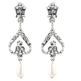 Crystal and pearl chandelier earrings made from high quality cubic zirconia clear crystals on a silver tone finish with ivory pearls, they have a drop of 3.5cm