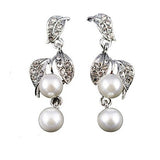 Crystal and pearl drop earrings made from high quality clear crystals and pretty ivory pearls in a leaf design on a sparkly silver tone finish, they have a drop of 3.5cm