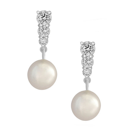 Crystal and pearl earrings made with high quality cubic zirconia crystals and ivory pearls on a rhodium finish, they have a drop 2.5cm. 
