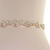 Close up view of Pearl and Crystal Bridal Belt on a gold finish mounted on an ivory ribbon
