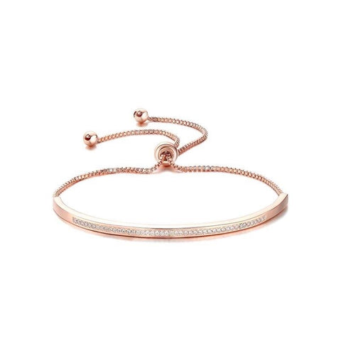 Adjustable crystal bracelet made with clear crystals on a rhodium plated rose gold tone finish, width 0.5cm. 