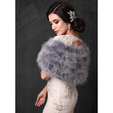 Side view of bride wearing a silver grey marabou feather stole wrap