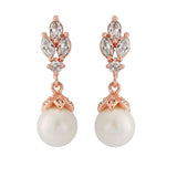 Crystal and pearl drop earrings made with clear cubic zirconia crystals and simulated ivory pearls on a rhodium plated rose gold finish, they measure 3cm long