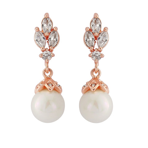 Crystal and pearl drop earrings made with clear cubic zirconia crystals and simulated ivory pearls on a rhodium plated rose gold finish, they measure 3cm long