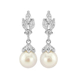 Crystal and pearl drop earrings made with clear cubic zirconia crystals and simulated ivory pearls on a rhodium plated silver tone finish, they measure 3cm long