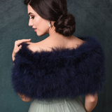 Back view of bride wearing a Navy Blue marabou feather stole wrap acroos her shoulders