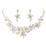 Pearl and crystal necklace and earrings set made with simulated ivory pearls and Swarovski crystals on a silver plated finish, the necklace is adjustable and the earrings measure 2.5cm