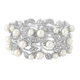 Stunning bracelet made with luxurious clear crystals and ivory pearls on a silver tone finish. 
