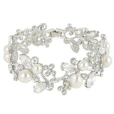Crystal and pearl bracelet made with simulated ivory pearls and Austrian clear glass crystals on a silver tone finish.