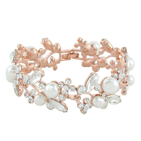 Crystal and pearl bracelet made with simulated ivory pearls and Austrian clear glass crystals on a rose gold finish. 