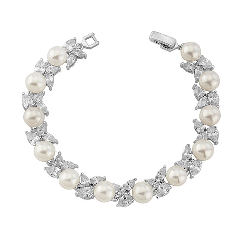 Crystal and pearl bracelet made with high quality cubic zirconia crystals and simulated ivory pearls on a rhodium plated finish