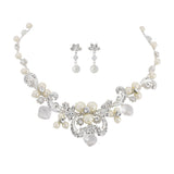 Crystal and pearl necklace and earrings set made with ivory pearls, Swarovski crystals and beads on a silver plated finish, the necklace is adjustable and the earrings have a drop of 1.5cm 