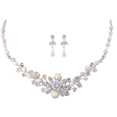 Pearl and crystal necklace and earrings set made with ivory pearls and cubic zirconia crystals on a high quality silver plated finish, the necklace is fully adjustable, the earrings have a drop of 1.5cm