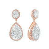 Crystal drop earrings made from top grade clear cubic zirconia crystals on a rose gold finish, they measure 3.5cm long by 1.5cm wide