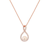 Crystal and pearl necklace made from clear cubic zirconia crystals on a crystal paved rhodium plated finish, the pendant measures 2cm long on a 17cm chain
