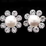 Crystal flower earrings made from Swarovski crystal elements with a man made pearl centre, they measure 1.5cm by 1.5cm. 