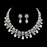 Crystal and pearl necklace and earrings set made with clear crystals and ivory pearls on a silver tone finish, the necklace is fully adjustable with matching earrings. 