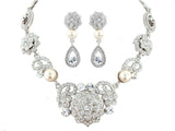 Crystal and pearl necklace and earrings set made from high quality cubic zirconia and Swarovski clear crystals with ivory pearls, the necklace is fully adjustable and the earrings measure 4.5cm. 