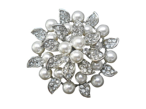Crystal and pearl brooch made with high quality simulated ivory pearls on a rhodium plated finish, the brooch measures 5.2cm by 5.2cm
