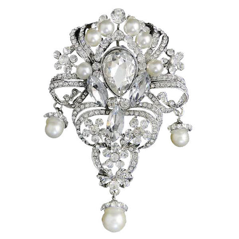 Crystal and pearl brooch on a silver tone finish with clear crystals and simulated pearls, brooch measures 9.5 by 6.5cm