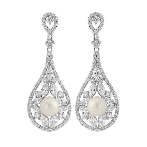 Crystal and pearl earrings made from high quality clear crystals and ivory pearls on a rhodium plated finish, they have a drop of 4.5cm and measure 2cm wide