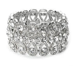 Elasticated crystal bracelet made with clear crystals on a silver tone finish, width 3.5cm. 