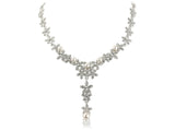 Fully adjustable necklace made from Swarovski crystal elements and high end simulated ivory pearls on a silver tone finish. 