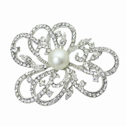 Crystal and pearl brooch made with clear crystals on a rhodium plated finish complimented by an ivory pearl 